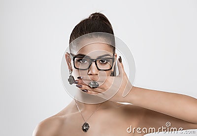 Woman covering mouth with has no right to talk speak no evil. Stock Photo