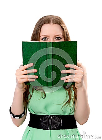 Woman covers her face with a book Stock Photo