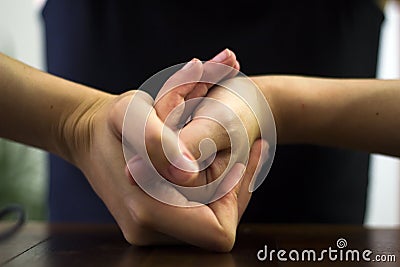 Woman cracking their knuckles Stock Photo