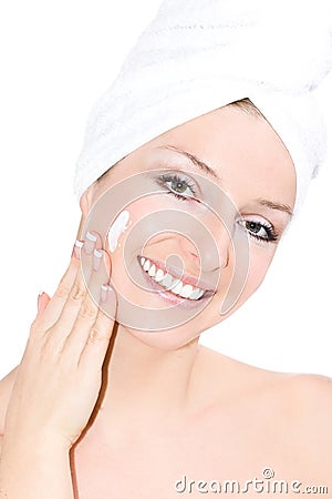 Woman creaming face Stock Photo