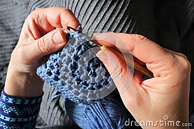 Woman crocheting a small bag Stock Photo