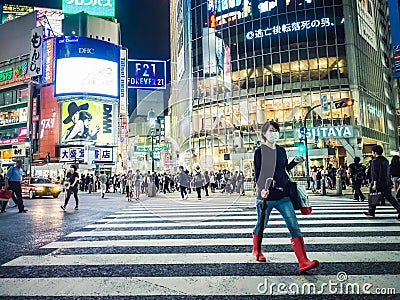 Woman Crossing after Crowds at Shibuya Crossing Japan Editorial Stock Photo