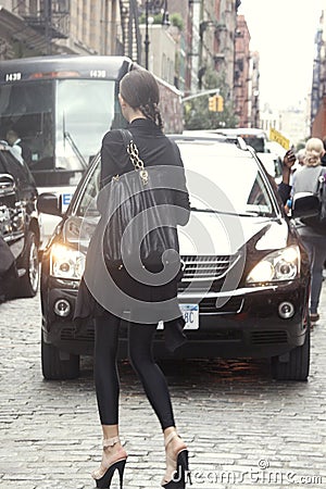 A woman crossing the street in New York Editorial Stock Photo