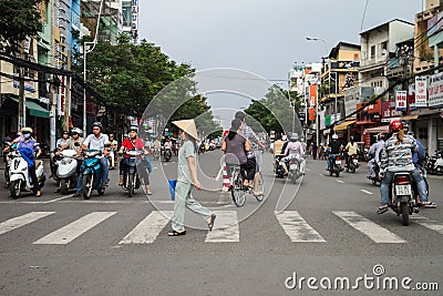 Woman Crossing Street In Vietnam Editorial Stock Photo