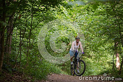 Woman is cycling Stock Photo