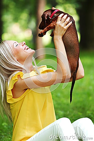 Woman dachshund in her arms Stock Photo