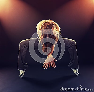 Woman dancer dancing modern dance, jump on a black Stock Photo