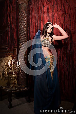 Woman dancing belly dance with shawl. Aesthetic of East Stock Photo