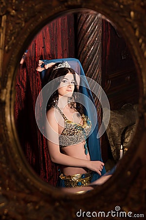 Woman dancing belly dance with shawl. Aesthetic of East Stock Photo