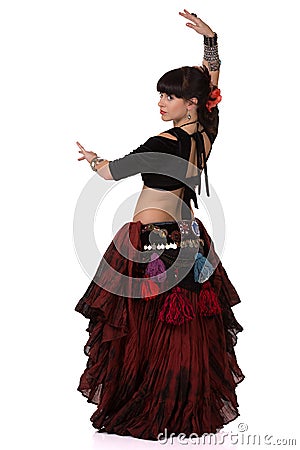 Woman dancing trible eastern belly dance. Back side. Stock Photo