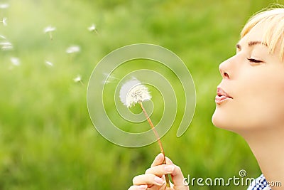 Woman with dandelion Stock Photo