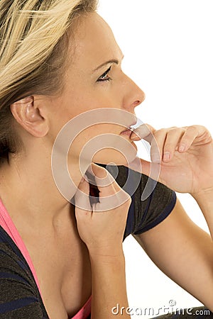 Woman dark dress close finger by mouth Stock Photo