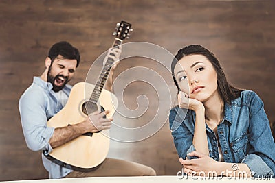 Woman daydreaming with hand on chin Stock Photo