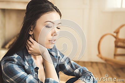 Woman daydreaming at home Stock Photo