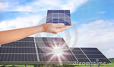 Woman demonstrating solar panel, closeup. Alternative energy source Stock Photo