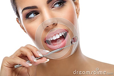 Woman with dental mirror Stock Photo