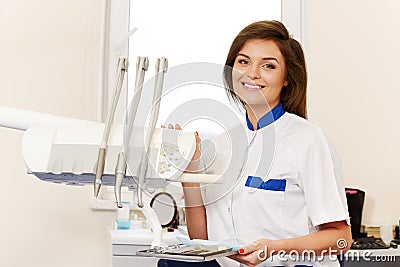 Woman dentist with dental tools Stock Photo