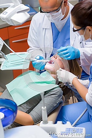 Woman at dentist surgery have teeth treatment Stock Photo