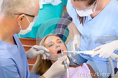 Woman at dentist surgery have treatment Stock Photo