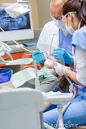 Woman at dentist surgery have treatment Stock Photo