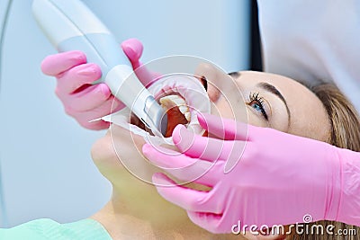 Woman dentist using dental intraoral scanner Stock Photo