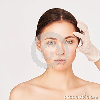 Woman derma treatment. Facial aesthetics anti age analysis. Cosmetology doctor Stock Photo