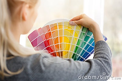 Woman designer choosing design color from swatch palett Stock Photo