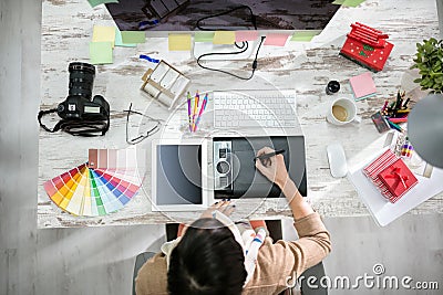 Woman designer working on the pen table Stock Photo