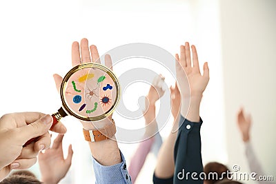Woman detecting bacteria with magnifying glass, closeup. Prevention disease Stock Photo