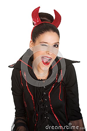 Woman in devil costume blinks eye. Stock Photo