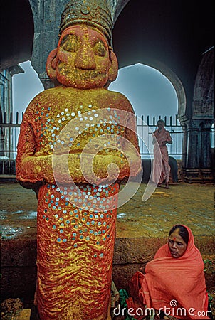 A woman devotee paying her respects to lord Khandoba at the Jejuri temple , Pune Editorial Stock Photo