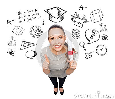 Woman with diploma showing thumbs up over doodles Stock Photo