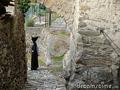 Woman disguised as a witch in the village of Triora in Liguria Editorial Stock Photo
