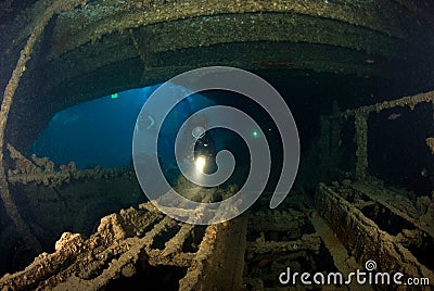 Woman diver on ship wreck Stock Photo