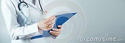 woman doctor hand documant on gray background. Stock Photo