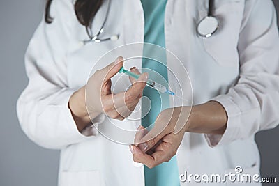 Woman doctor hand syringe Stock Photo