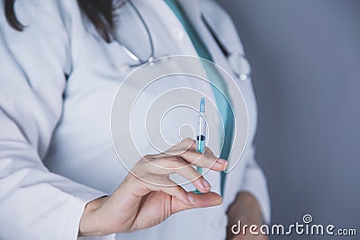 Woman doctor hand syringe Stock Photo