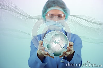 The woman doctor holding earth in globalisation concept Stock Photo