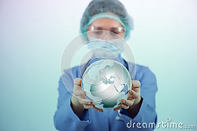 The woman doctor holding earth in globalisation concept Stock Photo