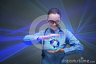 The woman doctor holding earth in globalisation concept Stock Photo