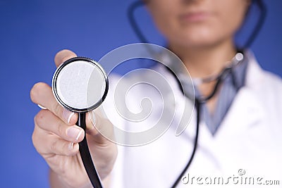 Woman doctor holding stethoscope. Nurse Stock Photo