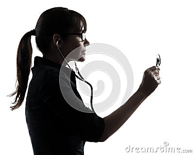 Woman doctor holding stethoscope silhouette Stock Photo