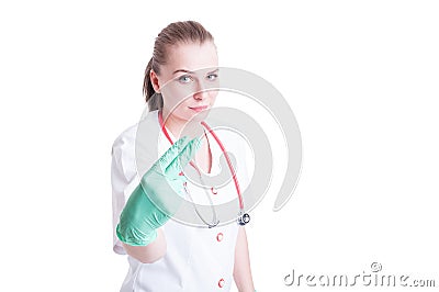 Woman doctor holding two fingers as penetration concept Stock Photo