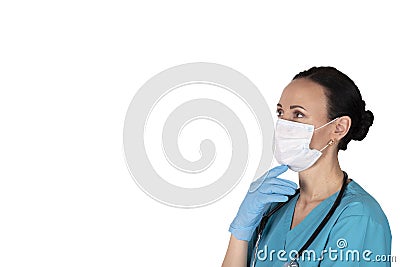 Woman doctor in profile in medical clothes. White background. Copy space Stock Photo
