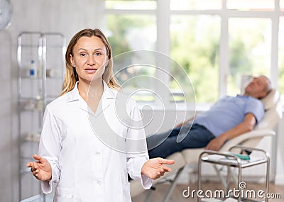 Woman doctor represents services provided in medical clinic Stock Photo