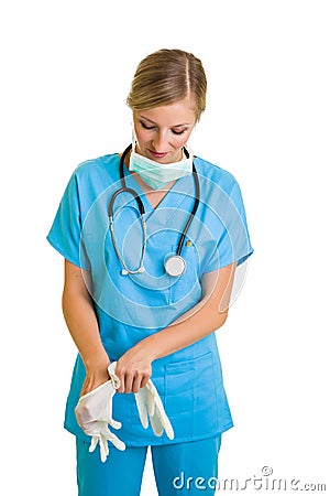 Woman in doctor uniform wearing latex gloves Stock Photo