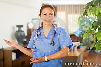 Woman doctor wear white medical uniform and stethoscope look at camera posing in clinic Stock Photo