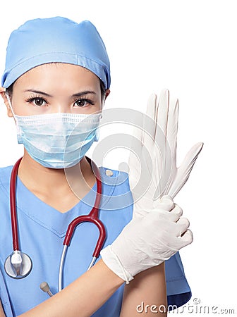 Woman doctor wearing medical gloves Stock Photo