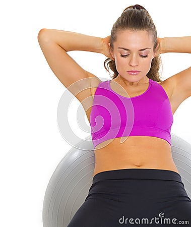 Woman doing abdominal crunch on fitness ball Stock Photo