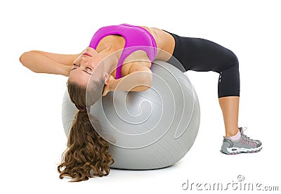 Woman doing abdominal crunch on fitness ball Stock Photo